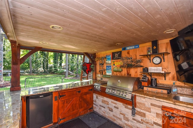 view of patio / terrace featuring grilling area, sink, and exterior kitchen