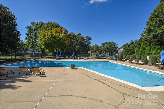 view of pool featuring a patio area