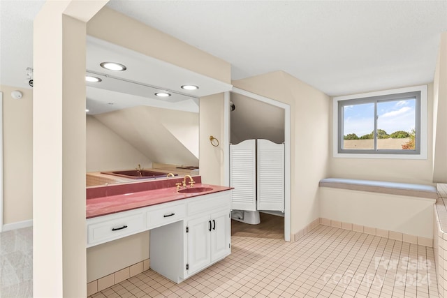 bathroom featuring vanity and tile patterned flooring