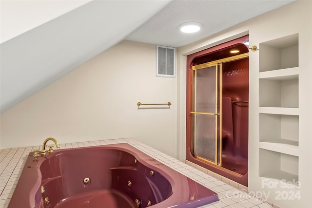 bathroom with lofted ceiling, tile patterned floors, built in shelves, and separate shower and tub