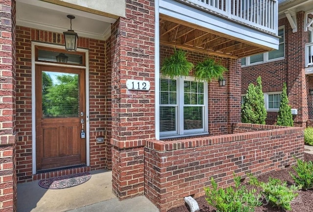 entrance to property featuring a balcony