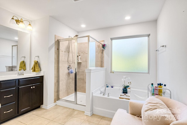 bathroom featuring vanity, separate shower and tub, and tile patterned flooring