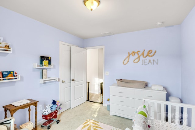 bedroom featuring light colored carpet