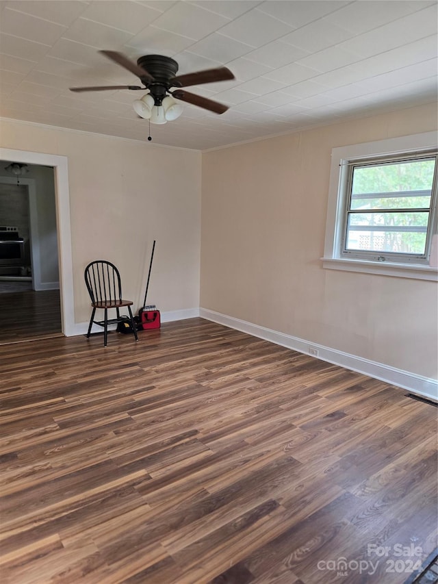 spare room with ceiling fan and dark hardwood / wood-style flooring