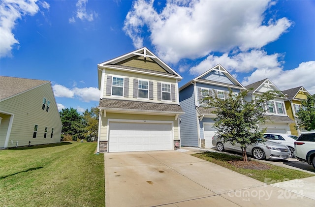 view of front of house with a front lawn and a garage