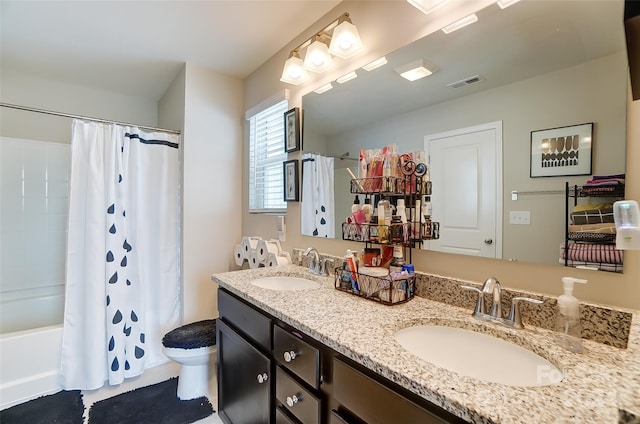 full bathroom with vanity, toilet, and shower / bath combo with shower curtain