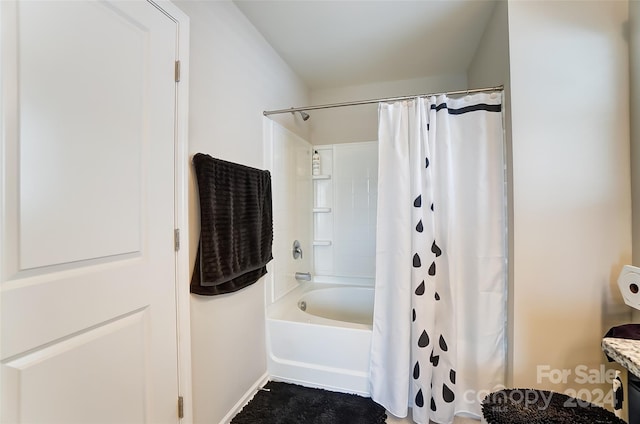 bathroom featuring vanity and shower / bath combo