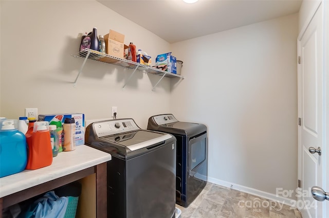 washroom featuring washer and dryer