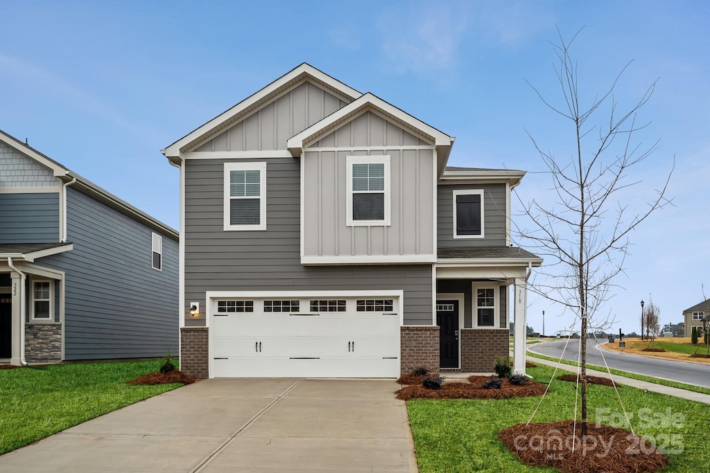 craftsman-style house with a front lawn and a garage