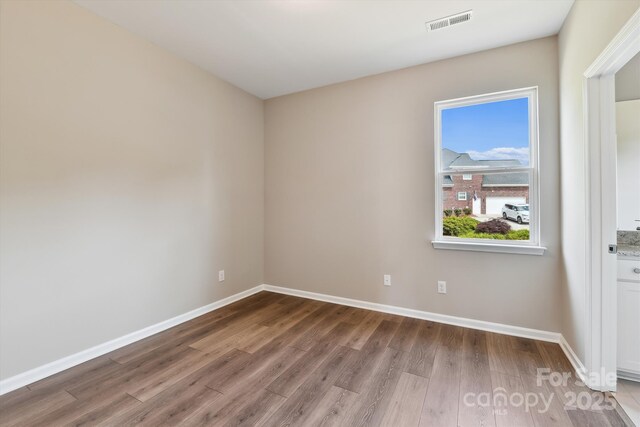 spare room featuring light hardwood / wood-style floors