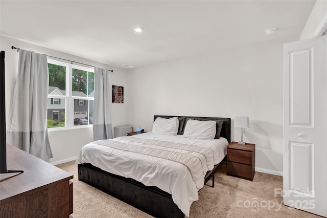 bedroom with carpet flooring and baseboards