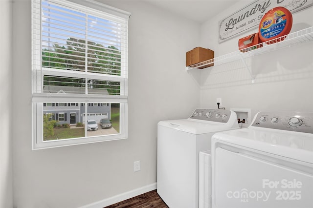 clothes washing area with baseboards, dark wood-type flooring, laundry area, and washer and clothes dryer