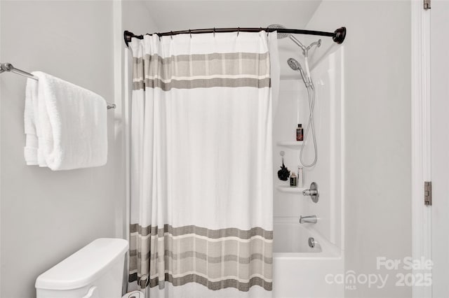full bath with shower / tub combo and toilet