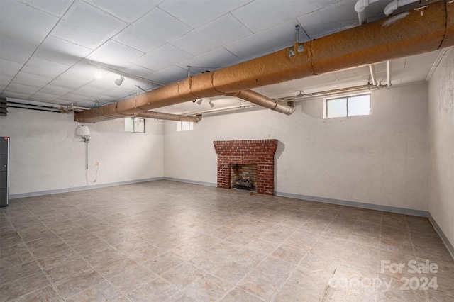 basement with a brick fireplace