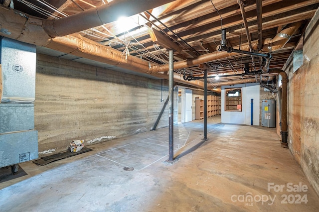 basement featuring electric water heater