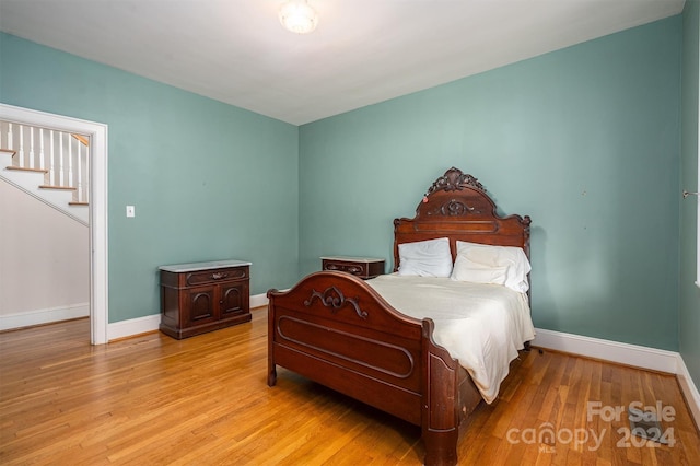 bedroom with light hardwood / wood-style floors