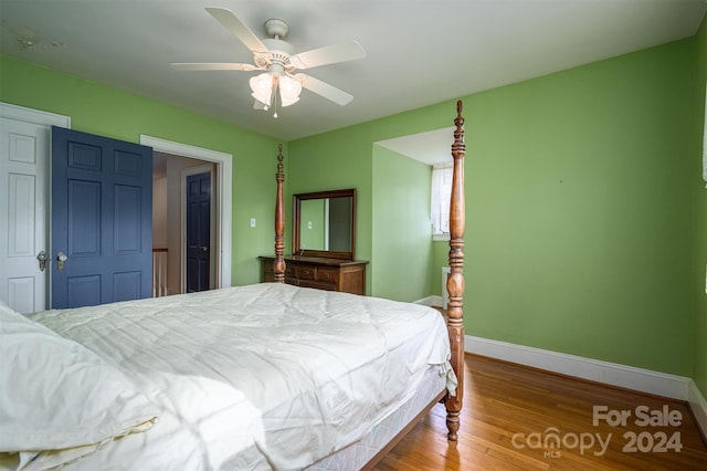 bedroom with hardwood / wood-style flooring and ceiling fan