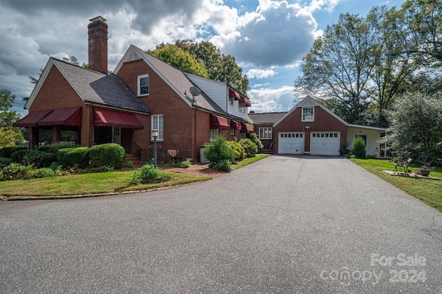 view of side of property with a garage