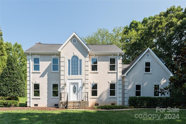 view of front of home with a front lawn