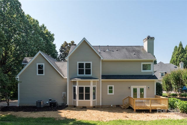 back of property featuring central AC and a deck