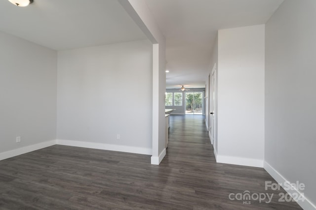 hallway with dark hardwood / wood-style floors