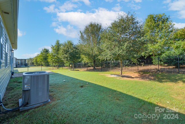 view of yard featuring central AC unit