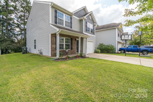 view of front of home featuring a front yard and a garage