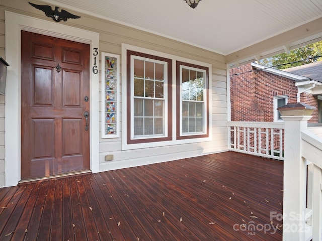 wooden terrace featuring a porch