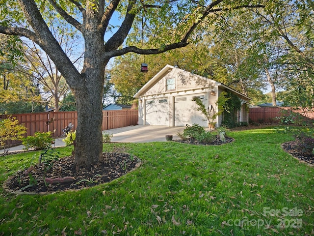 view of yard with a garage and an outdoor structure