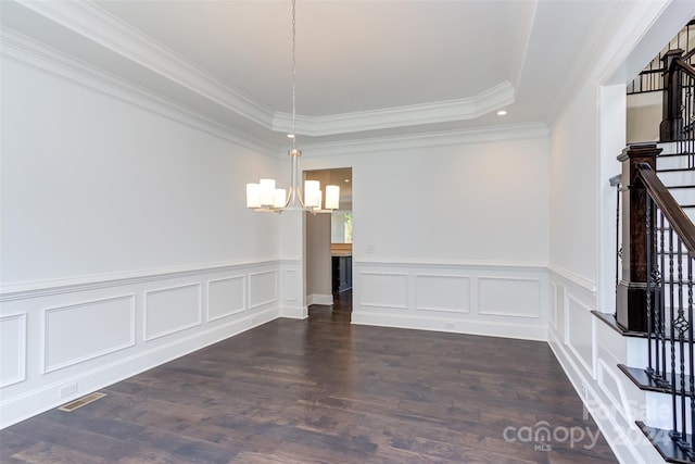 unfurnished dining area with a notable chandelier, wainscoting, dark wood finished floors, visible vents, and stairway