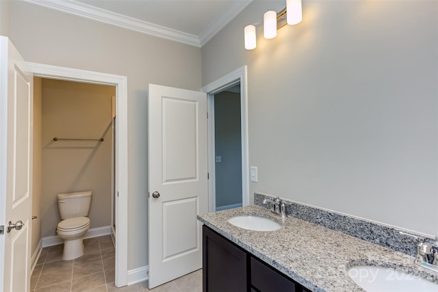 bathroom featuring tile patterned flooring, ornamental molding, vanity, and toilet