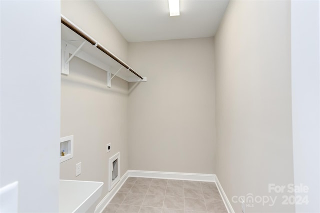 laundry area with hookup for an electric dryer, laundry area, baseboards, and washer hookup