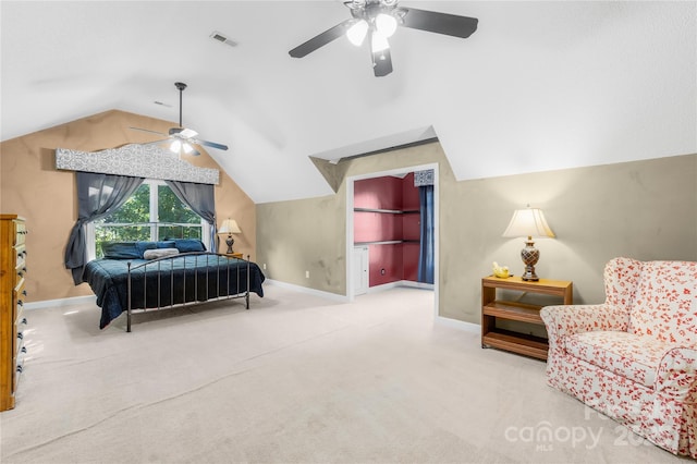 bedroom with light carpet, vaulted ceiling, and ceiling fan