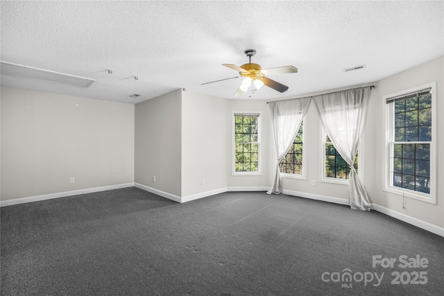 carpeted empty room featuring a textured ceiling and ceiling fan