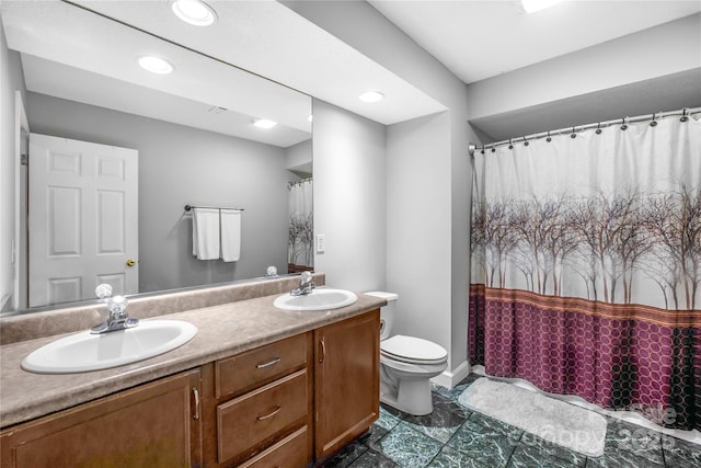 bathroom featuring vanity and toilet