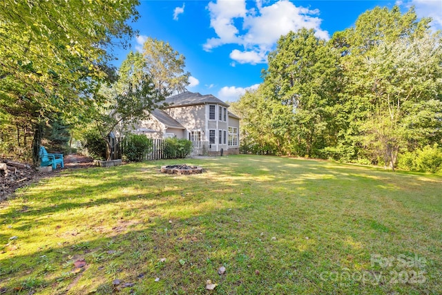 view of yard with an outdoor fire pit