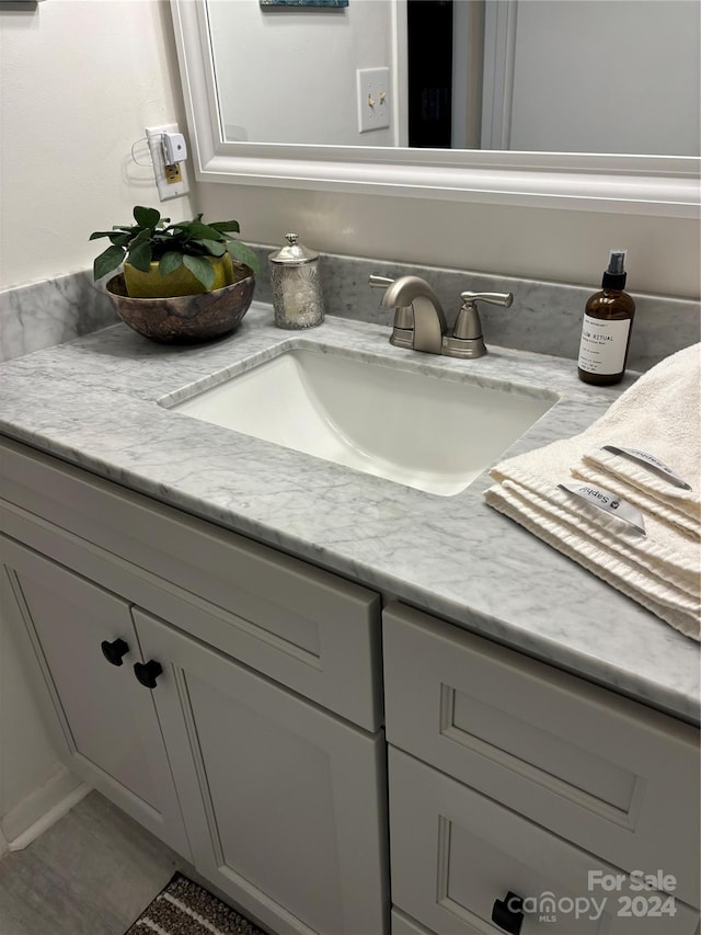 bathroom featuring tile patterned floors and vanity