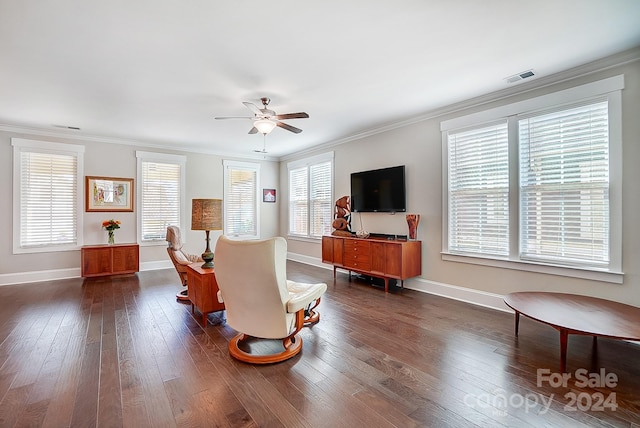 living room with crown molding, ceiling fan, and dark hardwood / wood-style floors