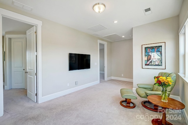 living area with light carpet