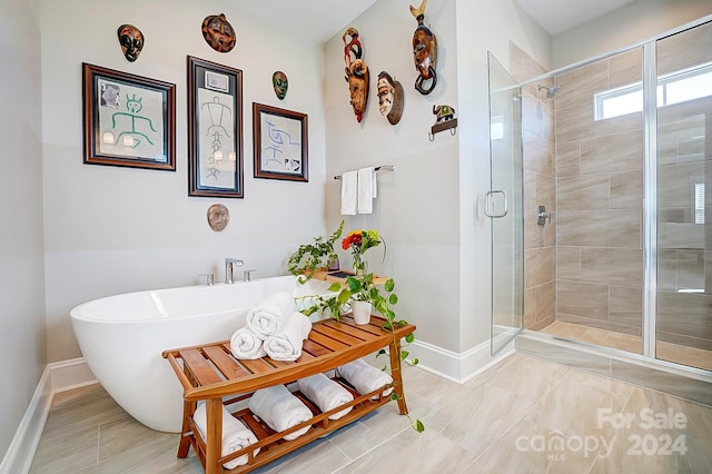 bathroom featuring independent shower and bath