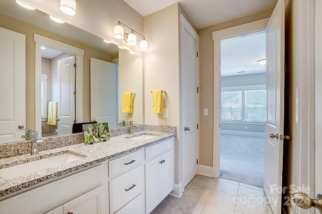 bathroom featuring tile patterned floors and vanity