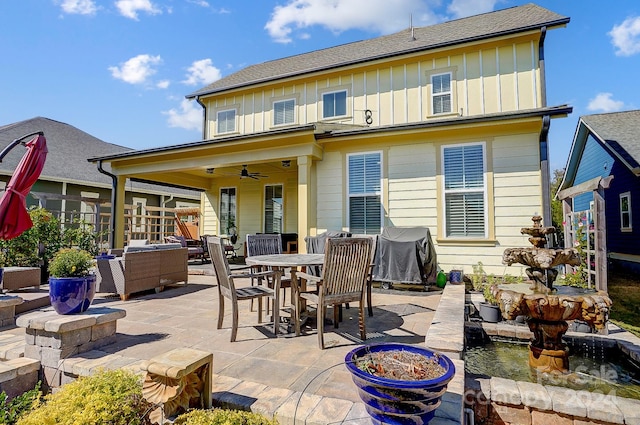 rear view of property featuring a patio, an outdoor living space with a fire pit, and ceiling fan