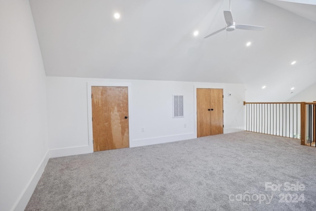 additional living space featuring vaulted ceiling, ceiling fan, and carpet floors