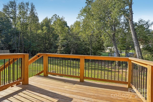 deck featuring a lawn