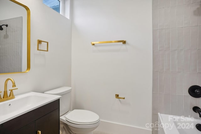 bathroom with toilet and vanity