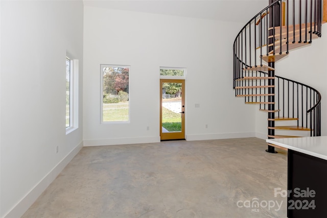 interior space with a high ceiling