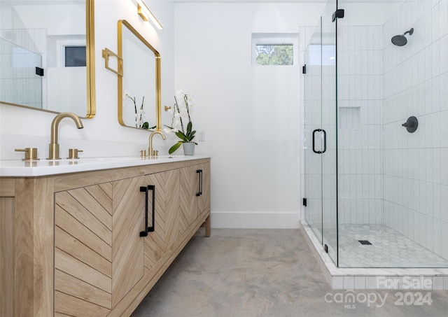 bathroom with walk in shower, vanity, and concrete floors