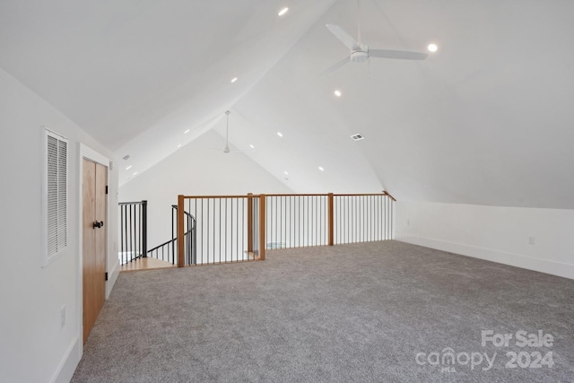 additional living space featuring lofted ceiling, ceiling fan, and carpet floors