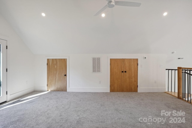 additional living space with ceiling fan, light carpet, and lofted ceiling