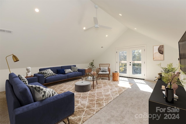 living room featuring vaulted ceiling, light carpet, ceiling fan, and french doors